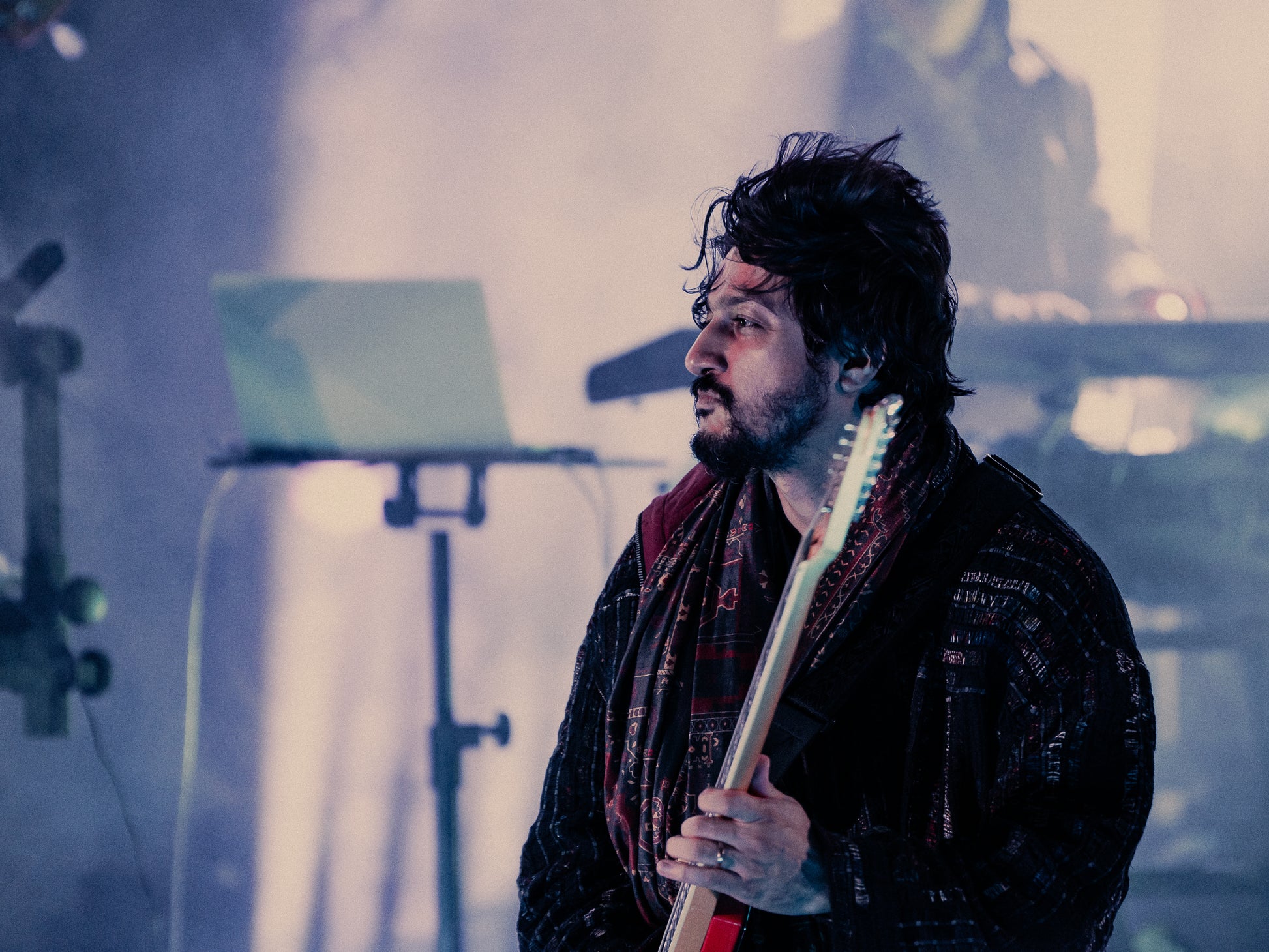 The Qaim Sherry Bomber in motion worn by Sherry Khattak, rockstar from Pakistan Coke Studio on stage at Federation Square in Naarm Melbourne, fusing performance and presence during Rising Festival.