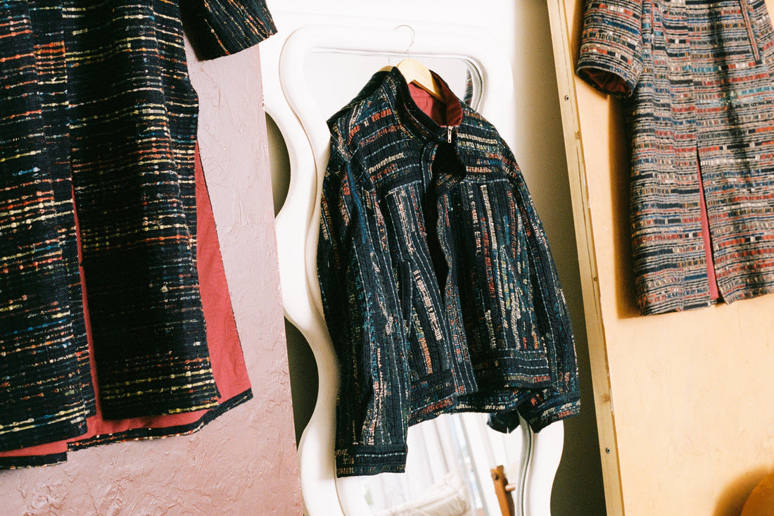 Limited-edition Qaim jackets and coats made from deadstock fabrics, photographed against a neutral backdrop