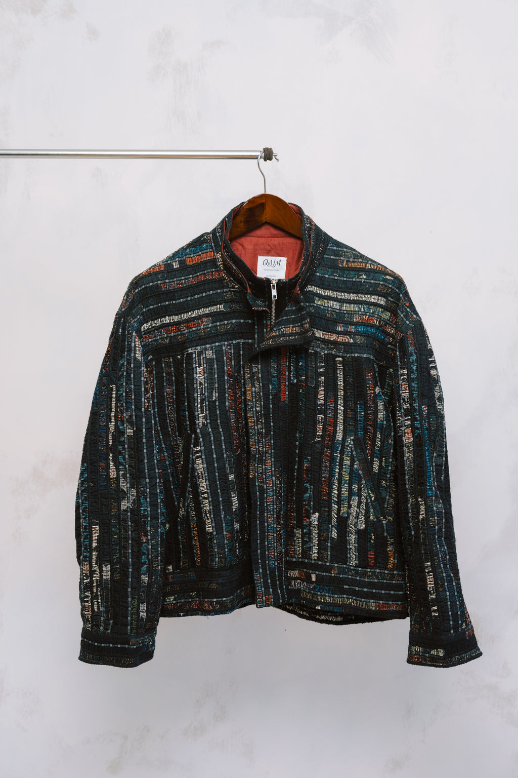 Front view of the Sherry Bomber – a structured, oversized jacket made from deep-toned upcycled fabrics, featuring a statement collar and relaxed silhouette.